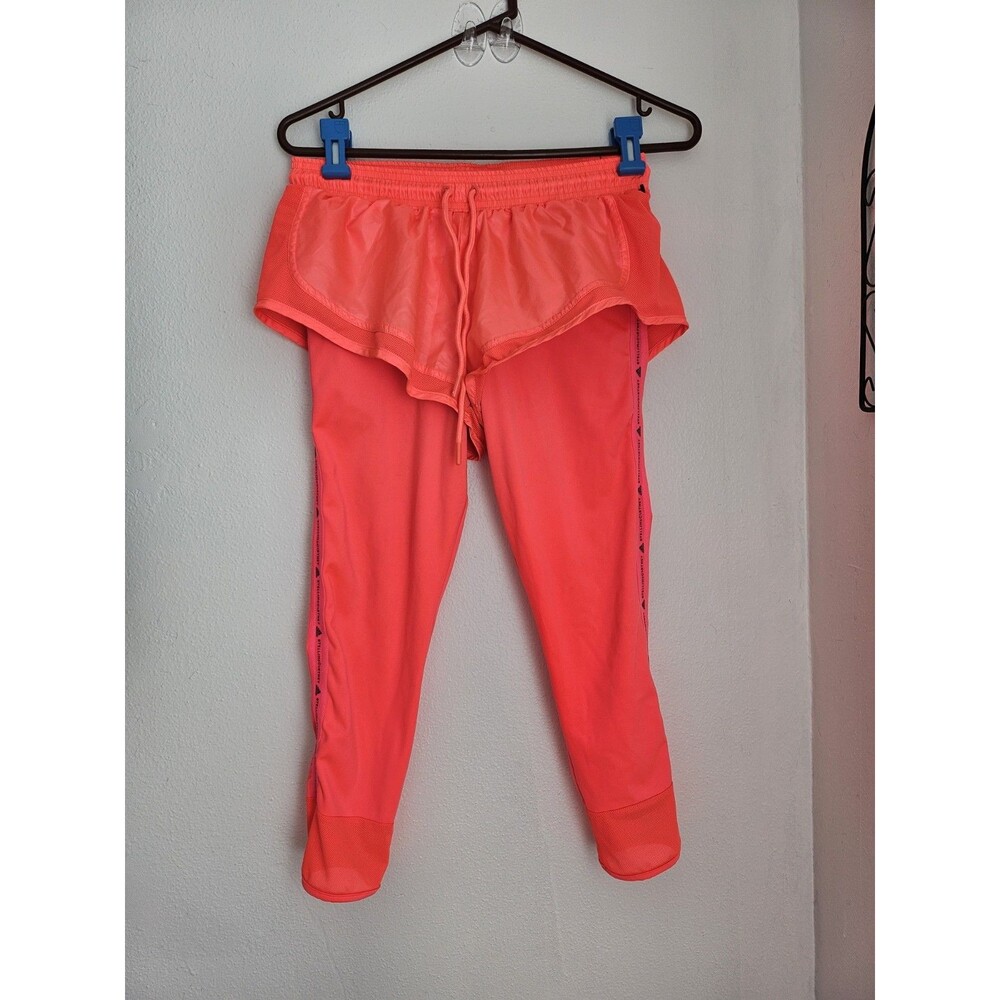 Adidas x Stella McCartney leggings featuring built-in shorts Neon. Athleticism